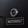 Masterbuilt Dual Fuel Smoker Braai - With Gas and Charcoal Grill Masterbuilt smoker braai temperature gauge showing heat levels for precise outdoor cooking.